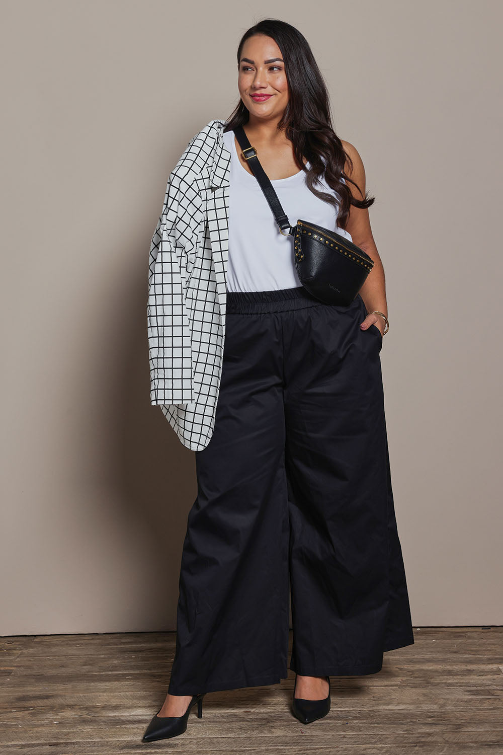 Model Ashleigh wearing size 16 of the Belle Cotton Palazzo Pant in colour Black (Black), from the front, showing the whole outfit