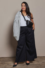 Model Ashleigh wearing size 16 of the Belle Cotton Palazzo Pant in colour Black (Black), from the front, showing the whole outfit