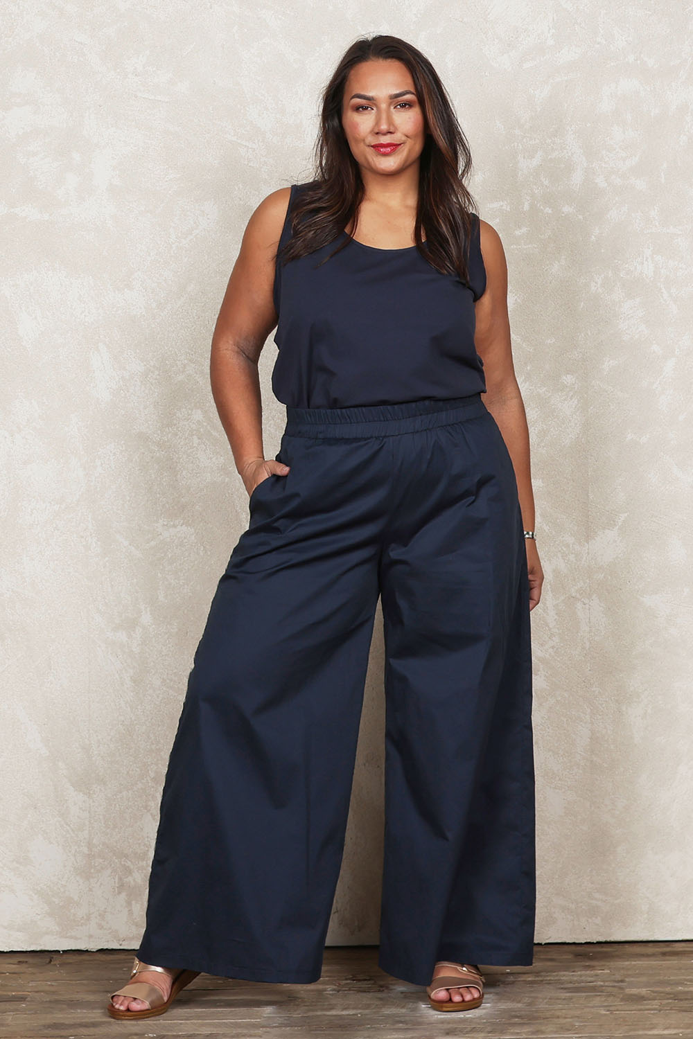 Model Ashleigh wearing size 16 of the Belle Cotton Palazzo Pant in colour Inknavy (Blue), from the front, showing the whole outfit
