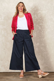 Model Olivia wearing size 10 of the Belle Cotton Palazzo Pant in colour Inknavy (Blue), from the front, showing the whole outfit