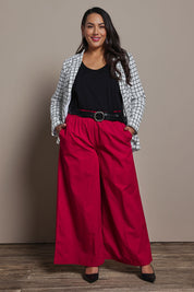 Model Ashleigh wearing size 16 of the Belle Cotton Palazzo Pant in colour Raspberry (Red), from the front, showing the whole outfit