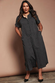 Model Ashleigh wearing size 16 of the Belle Striped Cotton Shirtmaker Dress in colour Blackred (Black), from the front, showing the whole outfit