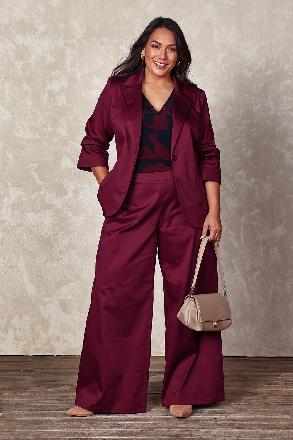Model Ashleigh wearing size 16 of the Belle Cotton Comfort Blazer in colour Burgundy (Purple), from the front, showing the whole outfit