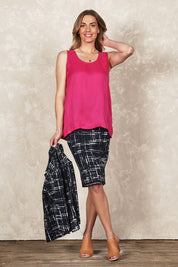 Model Olivia wearing size 10 of the Belle Luxe Cupro Blend Tank in colour Hotpink (Pink), from the front, showing the whole outfit