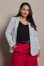 Model Ashleigh wearing size 16 of the Belle Printed Cotton Blazer in colour Whiteblack (White), from the front, cropped image