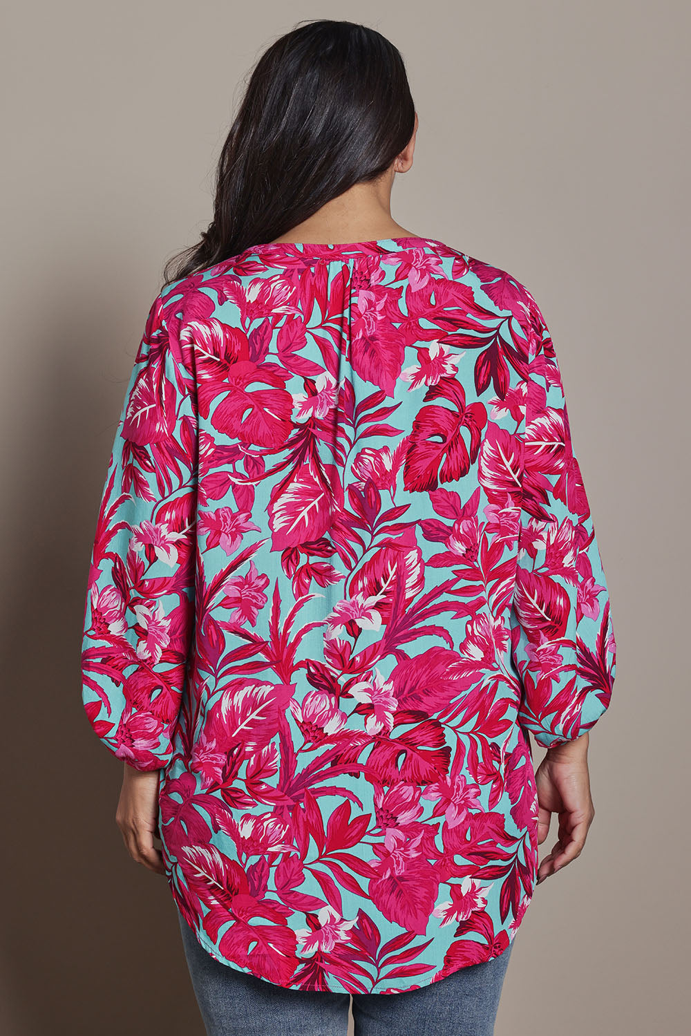 Model Ashleigh wearing size 16 of the Belle Printed Full Sleeve Shirt in colour Aquafusch (Pink), from the back