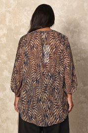 Model Ashleigh wearing size 16 of the Belle Printed Full Sleeve Shirt in colour Blacksand (Black), from the back