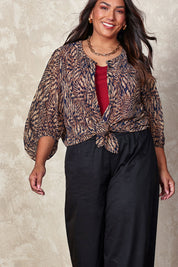 Model Ashleigh wearing size 16 of the Belle Printed Full Sleeve Shirt in colour Blacksand (Black), from the front, cropped image