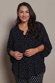 Model Ashleigh wearing size 16 of the Belle Printed Full Sleeve Shirt in colour Blackwhite (Black), from the front, cropped image
