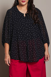 Model Ashleigh wearing size 16 of the Belle Printed Full Sleeve Shirt in colour Blackwhite (Black), from the front, cropped image