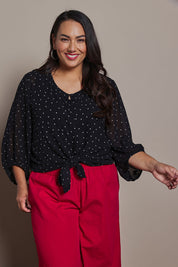 Model Ashleigh wearing size 16 of the Belle Printed Full Sleeve Shirt in colour Blackwhite (Black), from the front, cropped image