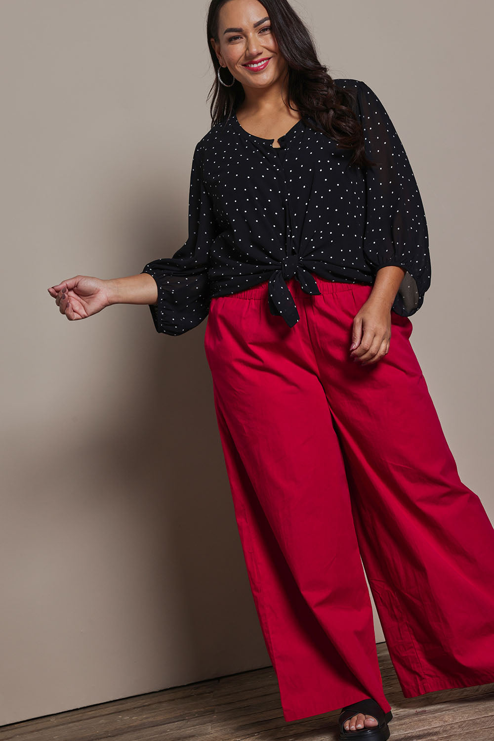 Model Ashleigh wearing size 16 of the Belle Printed Full Sleeve Shirt in colour Blackwhite (Black), from the front, showing the whole outfit