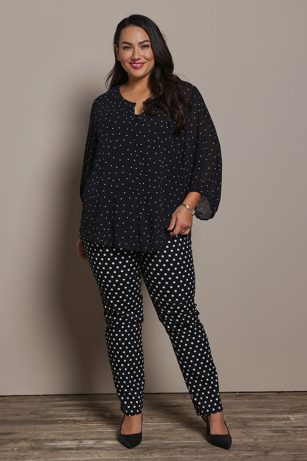 Model Ashleigh wearing size 16 of the Belle Printed Full Sleeve Shirt in colour Blackwhite (Black), from the front, showing the whole outfit