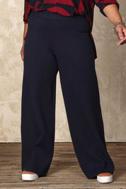 Model Ashleigh wearing size XL of the Belle Cosy Knit Pull On Wide Leg Pants in colour Navy (Blue), from the front, cropped image
