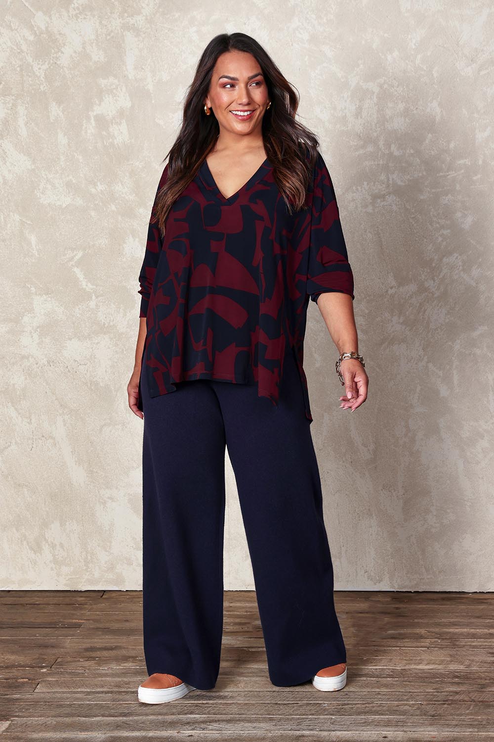 Model Ashleigh wearing size XL of the Belle Cosy Knit Pull On Wide Leg Pants in colour Navy (Blue), from the front, showing the whole outfit