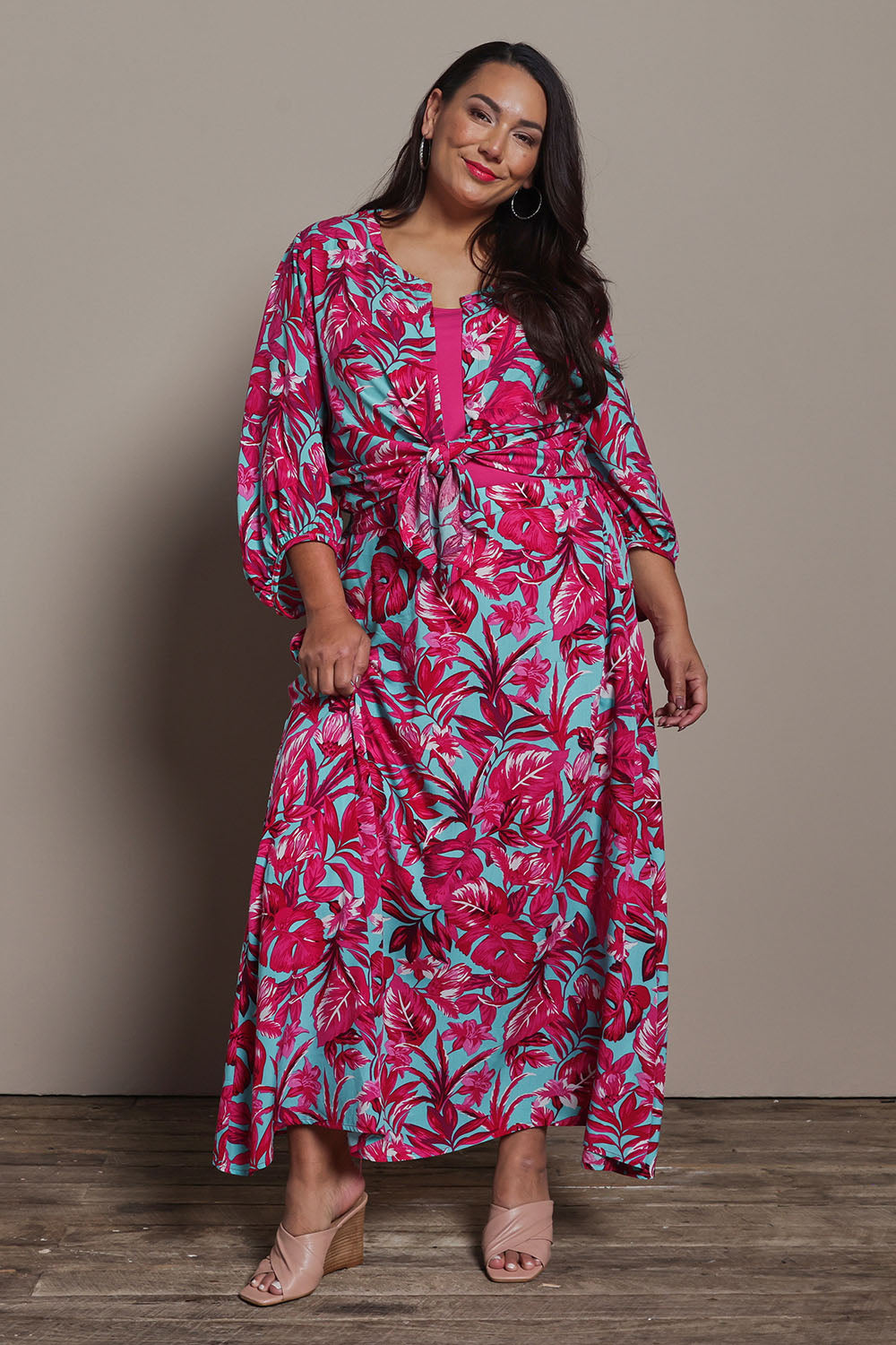 Model Ashleigh wearing size 16 of the Belle Printed Pull On Full Skirt with Pockets in colour Aquafusch (Pink), from the front, showing the whole outfit
