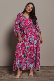 Model Ashleigh wearing size 16 of the Belle Printed Pull On Full Skirt with Pockets in colour Aquafusch (Pink), from the front, showing the whole outfit