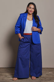 Model Ashleigh wearing size 16 of the Belle Cotton Stretch Palazzo Pant in colour Sapphire (Blue), from the front, showing the whole outfit
