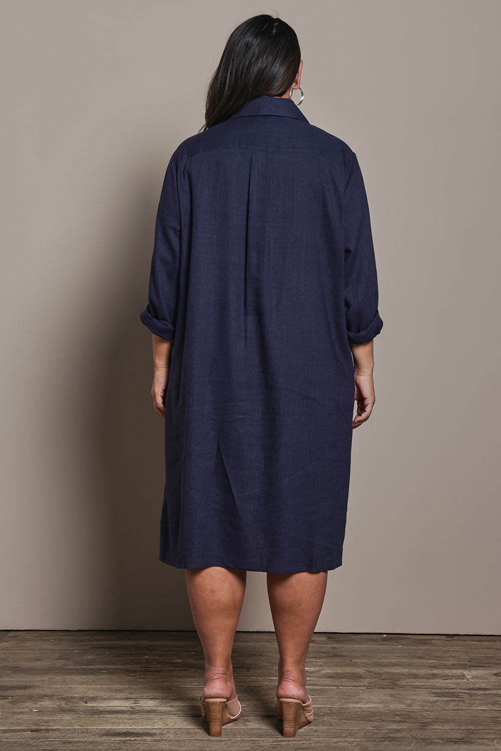 Model Ashleigh wearing size 16 of the Belle 3 Way Linen Blend Shirtmaker Dress in colour Navy (Blue), from the back