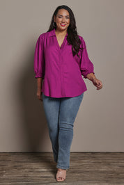 Model Ashleigh wearing size 16 of the Belle Luxe Shirred Sleeve Shirt in colour Magenta (Pink), from the front, showing the whole outfit