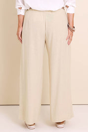 Model Lauraw wearing size 14 of the Belle Wear Anywhere Linen Blend Pants – Sand in colour Sand, from the back