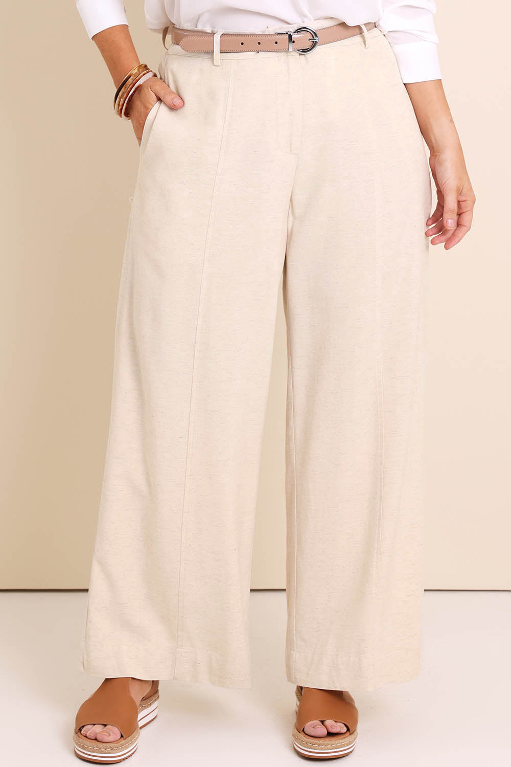 Model Lauraw wearing size 14 of the Belle Wear Anywhere Linen Blend Pants – Sand in colour Sand, in a cropped view