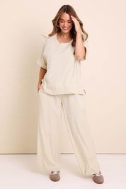 Model Lauraw wearing size 14 of the Belle Wear Anywhere Linen Blend Pants – Sand in colour Sand, from the front