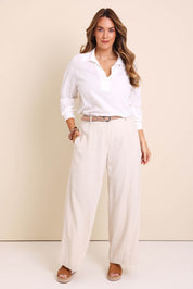Model Lauraw wearing size 14 of the Belle Wear Anywhere Pants – Sand in colour Sand, from the front