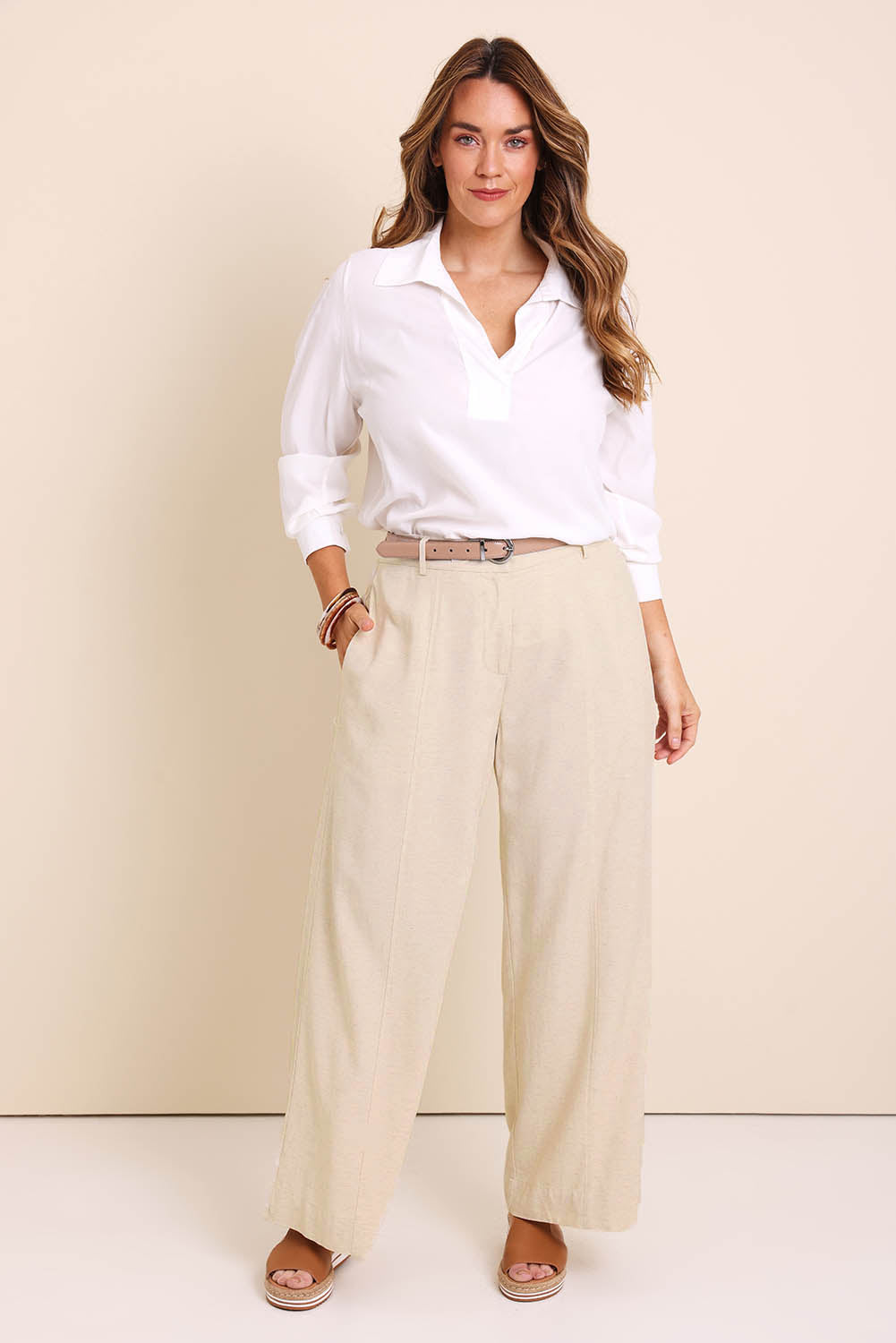 Model Lauraw wearing size 14 of the Belle Wear Anywhere Linen Blend Pants – Sand in colour Sand, from the front
