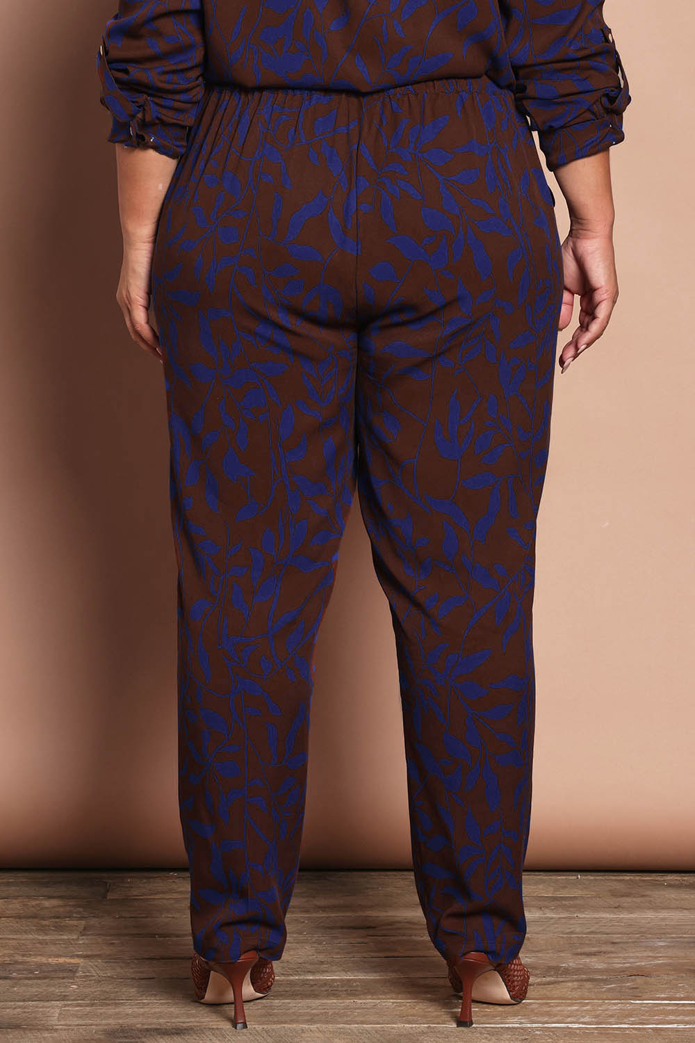 Model Ashleigh wearing size 16 of the Belle Luxe Ecovero Printed Draped Pant in colour Cobaltcoco (Blue), from the back