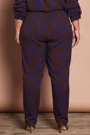 Model Ashleigh wearing size 16 of the Belle Luxe Ecovero Printed Draped Pant in colour Cobaltcoco (Blue), from the back