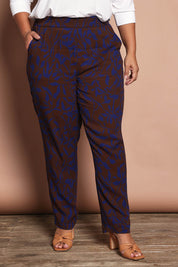 Model Ashleigh wearing size 16 of the Belle Luxe Ecovero Printed Draped Pant in colour Cobaltcoco (Blue), from the front, cropped image