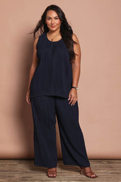 Model Ashleigh wearing size 16 of the Belle Crinkle No Iron Wide Leg Pant in colour Darknavy (Blue), from the front, showing the whole outfit