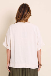 Model Lauraw wearing size 14 of the Belle Wear Anywhere Woven Tee  - Sand in colour Sand, from the back