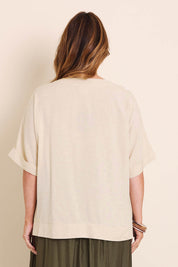Model Lauraw wearing size 14 of the Belle Wear Anywhere Woven Linen Blend Tee  - Sand in colour Sand, from the back
