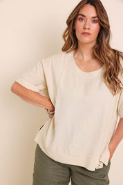 Model Lauraw wearing size 14 of the Belle Wear Anywhere Woven Linen Blend Tee  - Sand in colour Sand, in a cropped view