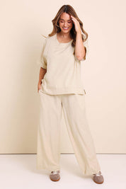 Model Lauraw wearing size 14 of the Belle Wear Anywhere Woven Linen Blend Tee  - Sand in colour Sand, from the front