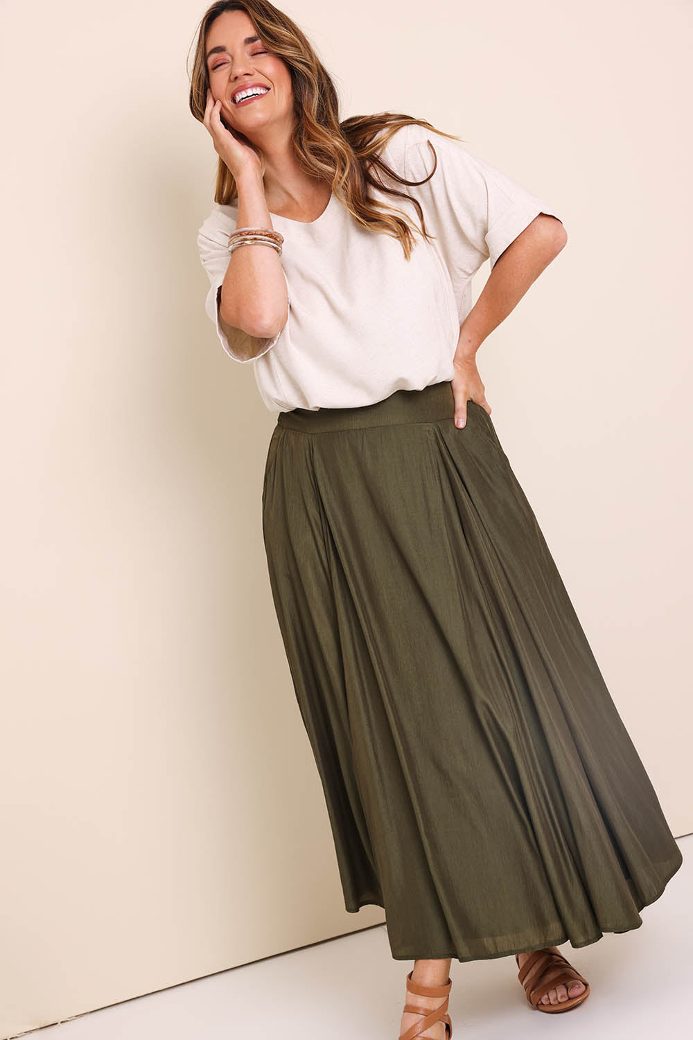 Model Lauraw wearing size 14 of the Belle Wear Anywhere Woven Tee  - Sand in colour Sand, from the front