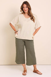 Model Lauraw wearing size 14 of the Belle Wear Anywhere Woven Linen Blend Tee  - Sand in colour Sand, from the front