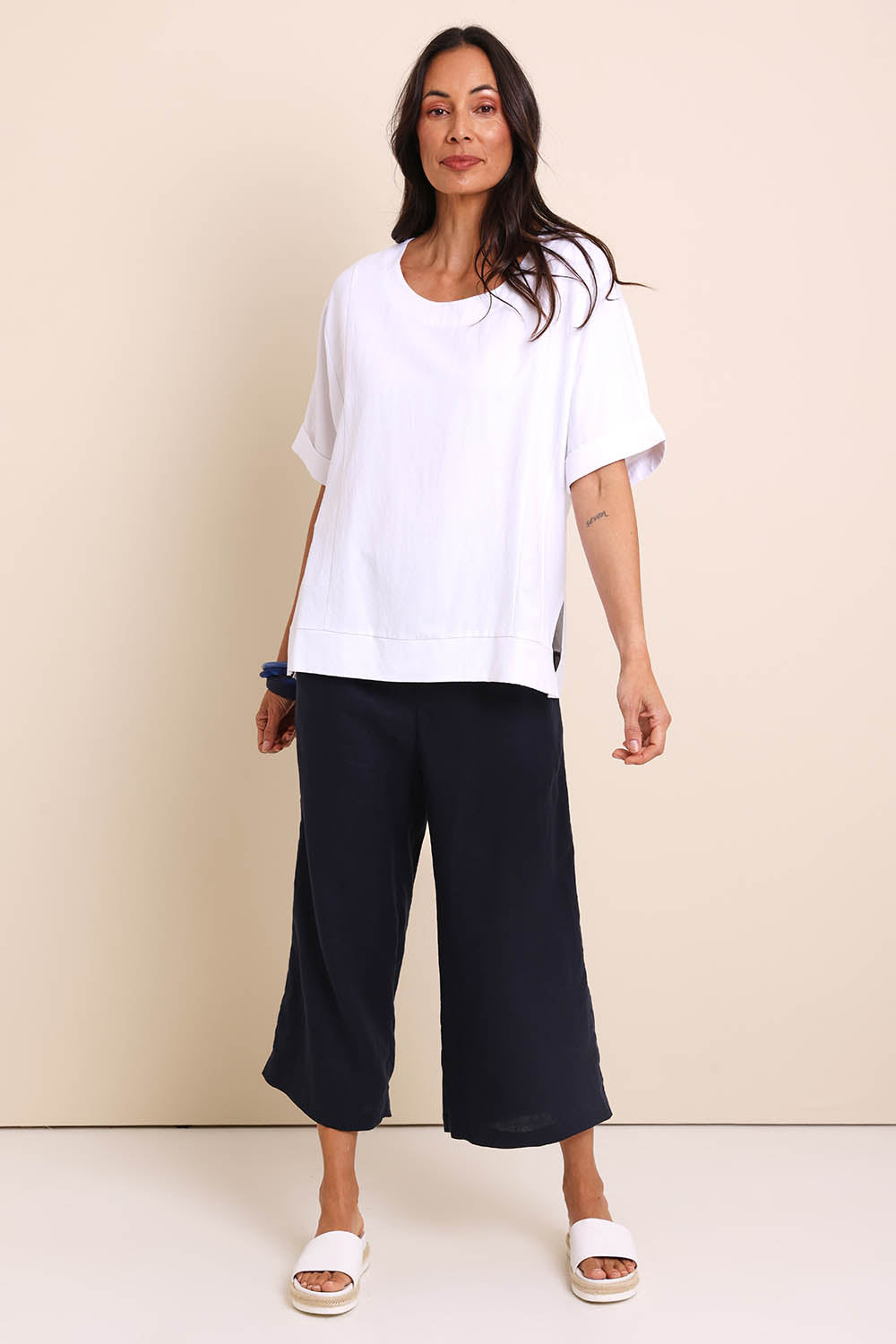 Model Amandam wearing size 10 of the Belle Wear Anywhere Woven Tee  - White in colour White, from the front