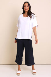 Model Amandam wearing size 10 of the Belle Wear Anywhere Woven Tee  - White in colour White, from the front