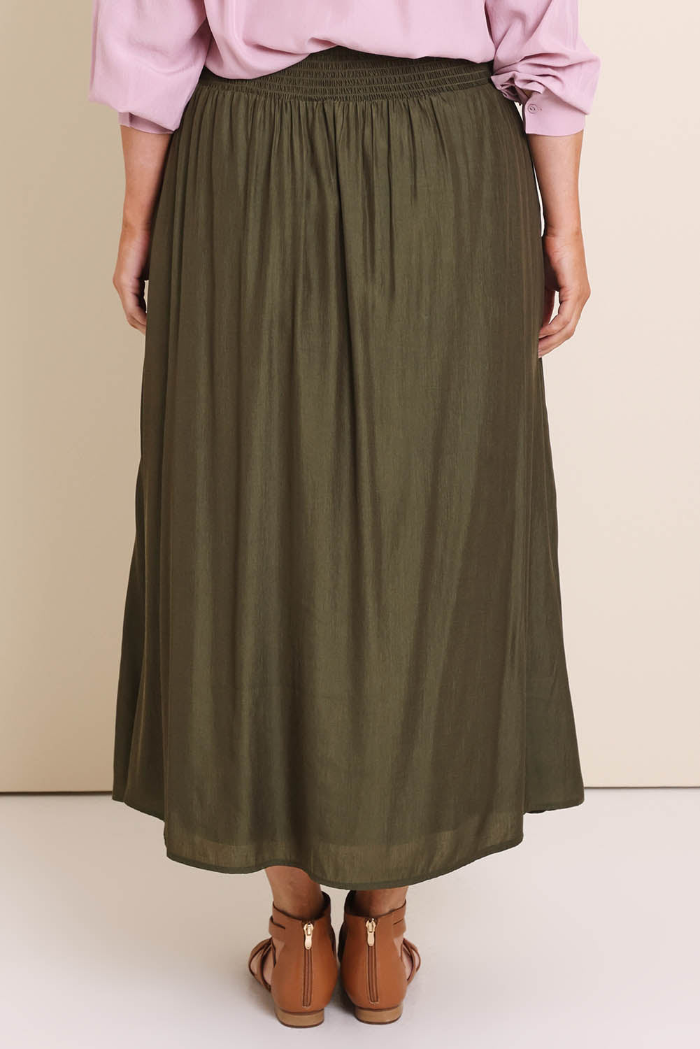 Model Lauraw wearing size 14 of the Belle Easy Wear Every Wear Skirt – Khaki in colour Khaki, from the back
