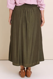 Model Lauraw wearing size 14 of the Belle Easy Wear Every Wear Skirt – Khaki in colour Khaki, from the back