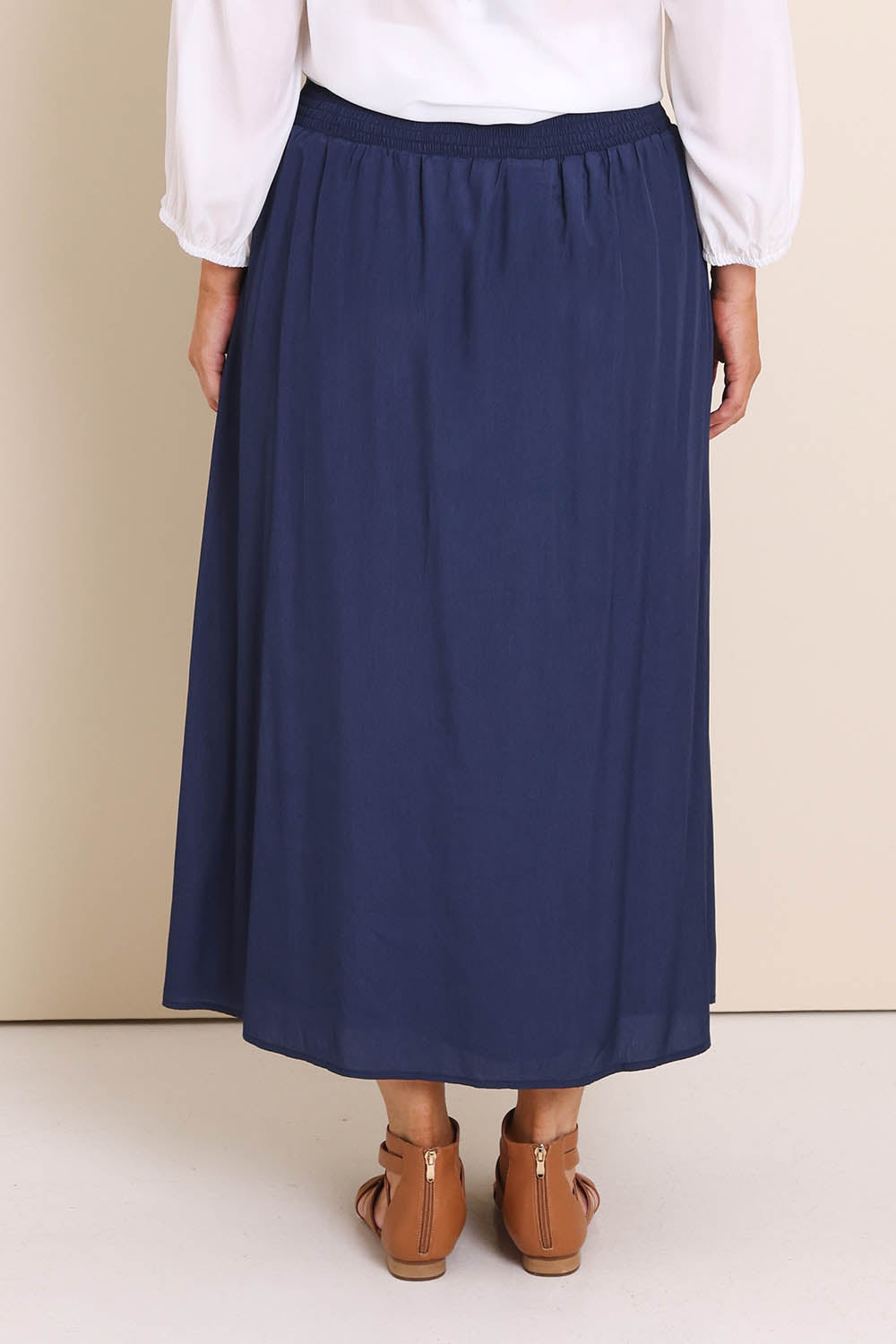 Model Lauraw wearing size 14 of the Belle Easy Wear Every Wear  Skirt  - Navy in colour Navy, from the back