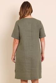 Model Lauraw wearing size 14 of the Belle Easy Wear Linen Dress With Pockets – Olive in colour Olive, from the back