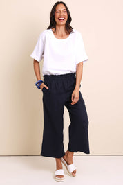 Model Amandam wearing size 10 of the Belle Easy Wear Linen Pant – Navy in colour Navy, from the front
