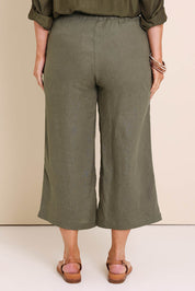 Model Lauraw wearing size 14 of the Belle Easy Wear Linen Pant – Olive in colour Olive, from the back
