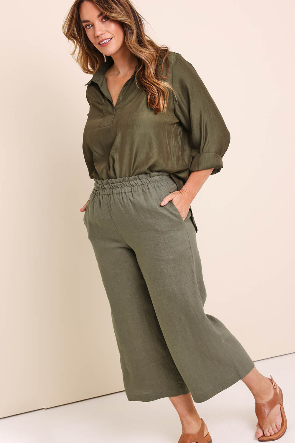 Model Lauraw wearing size 14 of the Belle Easy Wear Linen Pant – Olive in colour Olive, from the front