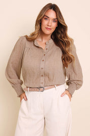 Model Lauraw wearing size 14 of the Belle Shirred Sleeve Shirt – Warmsand in colour Warmsand, in a cropped view