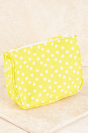A model wearing size OneSize of the Toiletry Bag in colour Yellow, from the front, showing the whole outfit